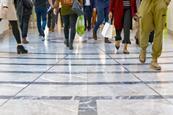 Feet of crowd of shoppers in shopping mall