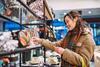 Female shopper looking at handbag in store