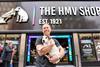 HMV owner Doug Putman poses with a dog outside HMV's Oxford Street store