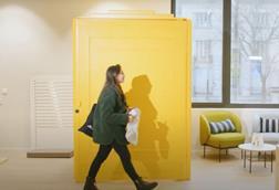 Woman using click and collect changing room at French post office