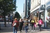 Shoppers on a sunny high street