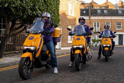 Three Getir delivery riders on a UK street