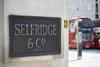 Brass Selfridges sign on London store wall