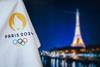 Paris-branded Olympics flag in front of Eiffel tower