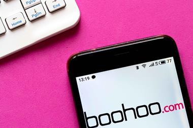 Boohoo-site-on-smartphone-next-to-keyboard