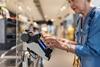 Woman paying for shopping using mobile