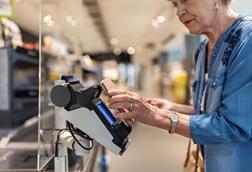 Woman paying for shopping using mobile