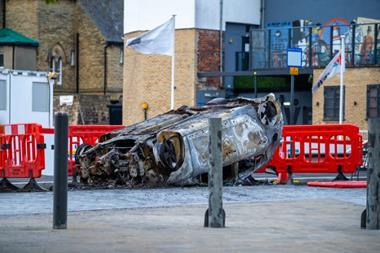 Burnt car in Sunderland following a riot in the city centre