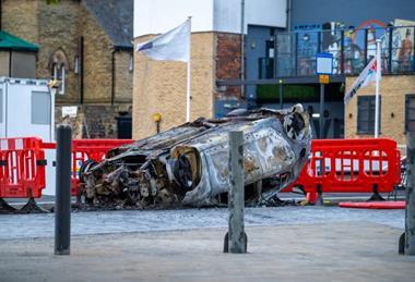 Burnt car in Sunderland following a riot in the city centre