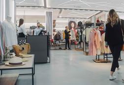 People shopping in fashion section of a store