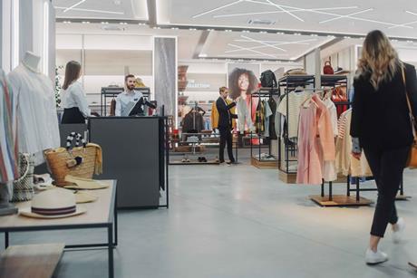 People shopping in fashion section of a store